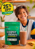 Child enjoying Super Henry chocolate greens with a glass of chocolate milk.