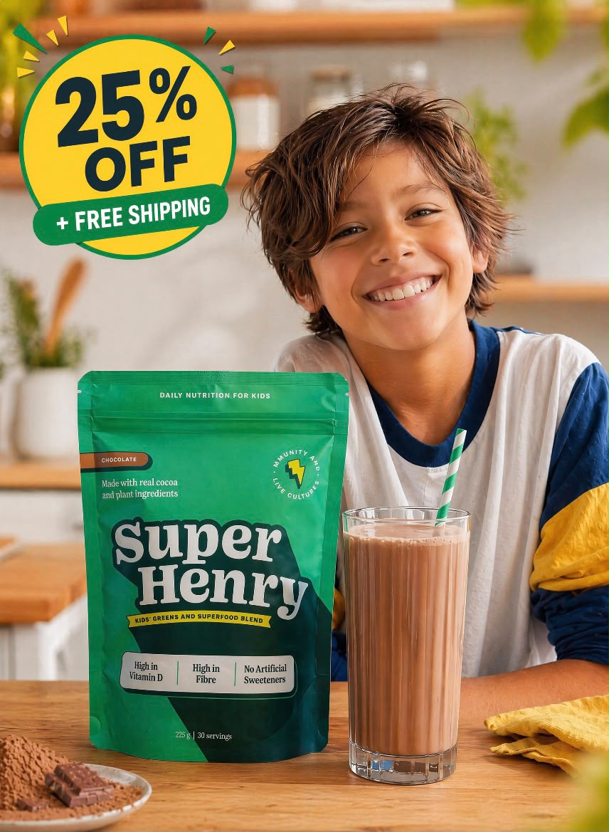 Child enjoying Super Henry chocolate greens with a glass of chocolate milk.